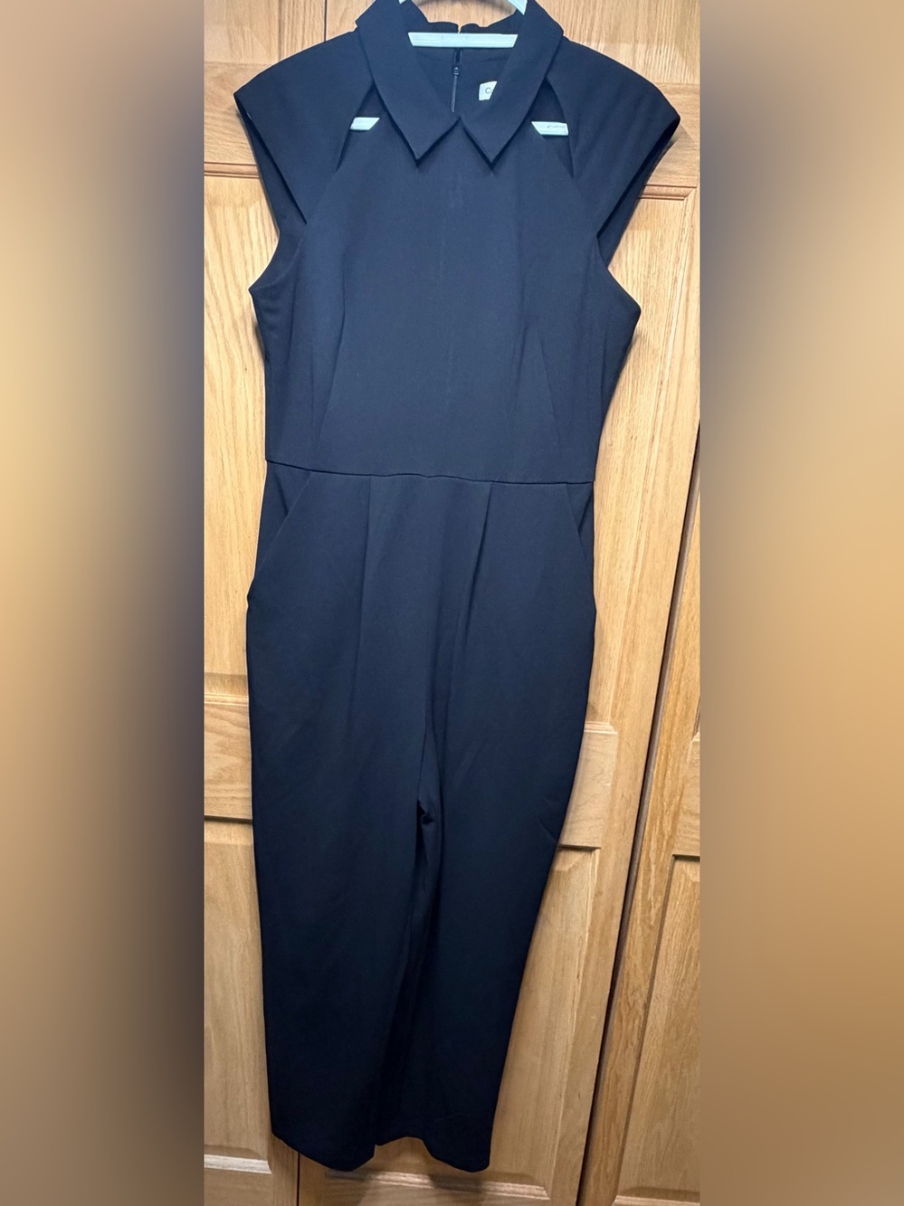 Calvin Klein Sleeveless Black Jumpsuit with cutouts Sz 10/ never worn
